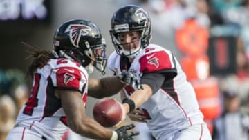 Dec 20, 2015; Jacksonville, FL, USA; Atlanta Falcons quarterback Matt Ryan (2) hands the ball off to Atlanta Falcons running back Devonta Freeman (24) in the third quarter against the Jacksonville Jaguars at EverBank Field. The Atlanta Falcons won 23-17. Mandatory Credit: Logan Bowles-USA TODAY Sports