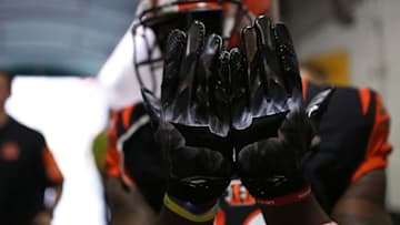 Dec 13, 2015; Cincinnati, OH, USA; Cincinnati Bengals wide receiver Mohamed Sanu (12) shows his Dark Knight gloves prior to the game against the Pittsburgh Steelers at Paul Brown Stadium. Mandatory Credit: Aaron Doster-USA TODAY Sports