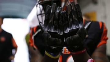 Dec 13, 2015; Cincinnati, OH, USA; Cincinnati Bengals wide receiver Mohamed Sanu (12) shows his Dark Knight gloves prior to the game against the Pittsburgh Steelers at Paul Brown Stadium. Mandatory Credit: Aaron Doster-USA TODAY Sports
