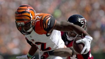 Sep 14, 2014; Cincinnati, OH, USA; Cincinnati Bengals wide receiver Mohamed Sanu (12) makes a catch against Atlanta Falcons cornerback Robert Alford (23) at Paul Brown Stadium. The Bengals won 24-10. Mandatory Credit: Aaron Doster-USA TODAY Sports