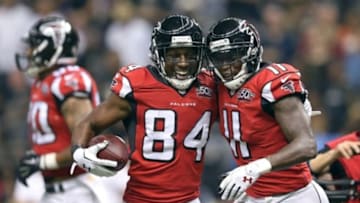 Oct 15, 2015; New Orleans, LA, USA; Atlanta Falcons wide receiver Roddy White (84) celebrates with wide receiver Julio Jones (11) after his touchdown catch in the second quarter against the New Orleans Saints of their game at the Mercedes-Benz Superdome. Mandatory Credit: Chuck Cook-USA TODAY Sports