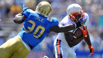 September 5, 2015; Pasadena, CA, USA; Virginia Cavaliers running back Albert Reid (5) runs the ball against the defense of UCLA Bruins linebacker Myles Jack (30) during the first half at the Rose Bowl. Mandatory Credit: Gary A. Vasquez-USA TODAY Sports