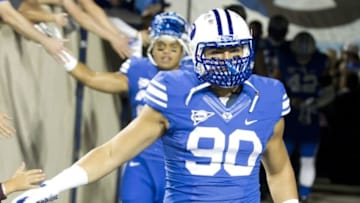 Oct 3, 2014; Provo, UT, USA; Brigham Young Cougars linebacker Bronson Kaufusi (90) enters the field prior to the game against the Utah State Aggies at Lavell Edwards Stadium. Utah State won 35-20. Mandatory Credit: Russ Isabella-USA TODAY Sports