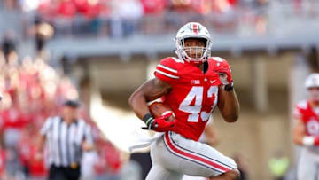 Sep 19, 2015; Columbus, OH, USA; Ohio State Buckeyes linebacker Darron Lee (43) returns the interception for a touchdown during the second half versus the Northern Illinois Huskies at Ohio Stadium. Ohio State won the game 20-13. Mandatory Credit: Joe Maiorana-USA TODAY Sports