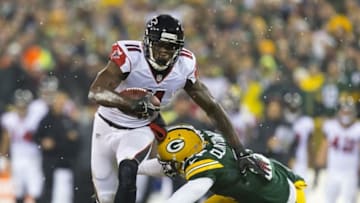 Dec 8, 2014; Green Bay, WI, USA; Atlanta Falcons wide receiver Julio Jones (11) carries the football as Green Bay Packers safety Ha Ha Clinton-Dix (21) defends during the first quarter at Lambeau Field. Mandatory Credit: Jeff Hanisch-USA TODAY Sports