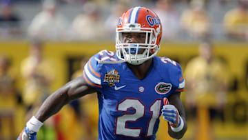 Jan 1, 2016; Orlando, FL, USA; Florida Gators running back Kelvin Taylor (21) runs during the second quarter against the Michigan Wolverines in the 2016 Citrus Bowl at Orlando Citrus Bowl Stadium. Mandatory Credit: Reinhold Matay-USA TODAY Sports