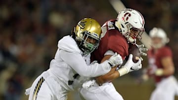 Oct 15, 2015; Stanford, CA, USA; Stanford Cardinal tight end Austin Hooper (18) is defended by UCLA Bruins defensive back Randall Goforth (3) in a NCAA football game at Stanford Stadium. Mandatory Credit: Kirby Lee-USA TODAY Sports