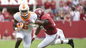 Oct 24, 2015; Tuscaloosa, AL, USA; Tennessee Volunteers running back Alvin Kamara (6) carries the ball against Alabama Crimson Tide linebacker Reggie Ragland (19) during the first quarter at Bryant-Denny Stadium. Mandatory Credit: John David Mercer-USA TODAY Sports
