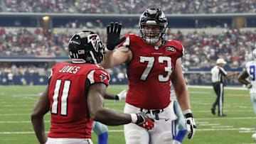 Sep 27, 2015; Arlington, TX, USA; Atlanta Falcons tackle Ryan Schraeder (73) celebrates with receiver Julio Jones (11) after a touchdown in the fourth quarter against the Dallas Cowboys at AT&T Stadium. Mandatory Credit: Matthew Emmons-USA TODAY Sports