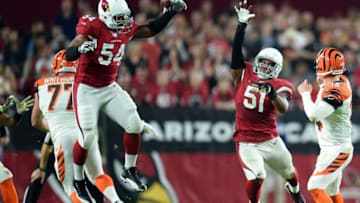 Nov 22, 2015; Glendale, AZ, USA; Cincinnati Bengals quarterback Andy Dalton (14) throws a pass by Arizona Cardinals linebacker Dwight Freeney (54) and Arizona Cardinals middle linebacker Kevin Minter (51) at University of Phoenix Stadium. Mandatory Credit: Joe Camporeale-USA TODAY Sports