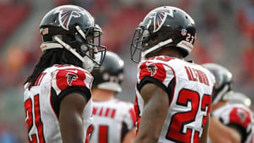 Nov 9, 2014; Tampa, FL, USA; Atlanta Falcons cornerback Desmond Trufant (21) and cornerback Robert Alford (23) talk against the Tampa Bay Buccaneers during the second half at Raymond James Stadium. Atlanta Falcons defeated the Tampa Bay Buccaneers 27-17. Mandatory Credit: Kim Klement-USA TODAY Sports
