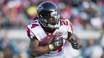 Dec 20, 2015; Jacksonville, FL, USA; Atlanta Falcons running back Devonta Freeman (24) carries the ball in the third quarter against the Jacksonville Jaguars at EverBank Field.The Atlanta Falcons won 23-17. Mandatory Credit: Logan Bowles-USA TODAY Sports