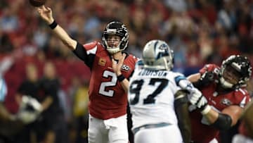 Dec 27, 2015; Atlanta, GA, USA; Atlanta Falcons quarterback Matt Ryan (2) throws the ball under pressure from Carolina Panthers defensive end Mario Addison (97) in the first quarter at the Georgia Dome. Mandatory Credit: Dale Zanine-USA TODAY Sports