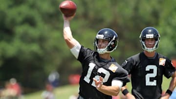 Jun 17, 2015; Atlanta, GA, USA; Atlanta Falcons quarterback Sean Renfree (12) throws a pass as quarterback Matt Ryan (2) watches during minicamp at Falcons Training Facility. Mandatory Credit: Brett Davis-USA TODAY Sports