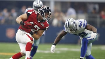 Sep 27, 2015; Arlington, TX, USA; Atlanta Falcons fullback Patrick DiMarco (42) is tackled by Dallas Cowboys strong safety Barry Church (42) in the third quarter at AT&T Stadium. Atlanta won 39-28. Mandatory Credit: Tim Heitman-USA TODAY Sports