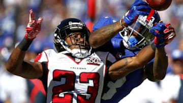 Sep 20, 2015; East Rutherford, NJ, USA; Atlanta Falcons cornerback Robert Alford (23) knocks the ball away from New York Giants wide receiver Odell Beckham (13) during first half at MetLife Stadium. Mandatory Credit: Noah K. Murray-USA TODAY Sports