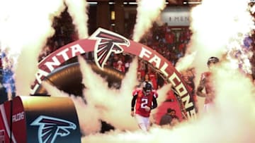 Nov 30, 2014; Atlanta, GA, USA; Atlanta Falcons quarterback Matt Ryan (2) runs onto the field during pregame introductions before their game against the Arizona Cardinals at the Georgia Dome. The Falcons won 29-18. Mandatory Credit: Jason Getz-USA TODAY Sports
