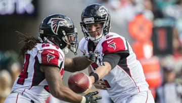 Dec 20, 2015; Jacksonville, FL, USA; Atlanta Falcons quarterback Matt Ryan (2) hands the ball off to Atlanta Falcons running back Devonta Freeman (24) in the third quarter against the Jacksonville Jaguars at EverBank Field. The Atlanta Falcons won 23-17. Mandatory Credit: Logan Bowles-USA TODAY Sports