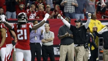 Jan 3, 2016; Atlanta, GA, USA; Atlanta Falcons head coach Dan Quinn and cornerback Desmond Trufant (21) celebrate a turnover in the fourth quarter of their game against the New Orleans Saints at the Georgia Dome. The Saints won 20-17. Mandatory Credit: Jason Getz-USA TODAY Sports