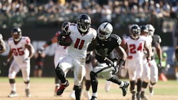 Sep 18, 2016; Oakland, CA, USA; Atlanta Falcons wide receiver Julio Jones (11) runs with the ball after making a catch against the Oakland Raiders in the fourth quarter at Oakland-Alameda County Coliseum. The Falcons defeated the Raiders 35-28. Mandatory Credit: Cary Edmondson-USA TODAY Sports