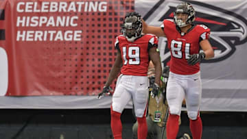 Oct 2, 2016; Atlanta, GA, USA; Atlanta Falcons wide receiver Aldrick Robinson (19) reacts with tight end Austin Hooper (81) after catching a touchdown pass against the Carolina Panthers during the second half at the Georgia Dome. The Falcons defeated the Panthers 48-33. Mandatory Credit: Dale Zanine-USA TODAY Sports