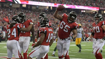 Oct 30, 2016; Atlanta, GA, USA; Atlanta Falcons offensive guard Chris Chester (65) spikes the ball after running back Devonta Freeman (24) scored a touchdown against the Green Bay Packers during the second quarter at the Georgia Dome. Mandatory Credit: Dale Zanine-USA TODAY Sports