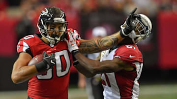 Nov 27, 2016; Atlanta, GA, USA; Atlanta Falcons tight end Levine Toilolo (80) straight arms Arizona Cardinals cornerback Patrick Peterson (21) during the second half at the Georgia Dome. The Falcons defeated the Cardinals 38-19. Mandatory Credit: Dale Zanine-USA TODAY Sports