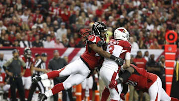 Nov 27, 2016; Atlanta, GA, USA; Atlanta Falcons defensive end Adrian Clayborn (left) and defensive end Courtney Upshaw (91) hit Arizona Cardinals quarterback Carson Palmer (3) after a pass attempt in the third quarter of their game at the Georgia Dome. The Falcons won 38-19. Mandatory Credit: Jason Getz-USA TODAY Sports