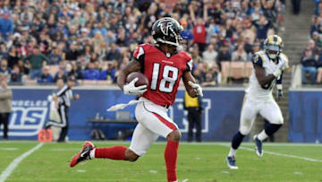 Dec 11, 2016; Los Angeles, CA, USA; Atlanta Falcons wide receiver Taylor Gabriel (18) scores on a 64-yard touchdown reception in the third quarter against the Los Angeles Rams at Los Angeles Memorial Coliseum. Mandatory Credit: Kirby Lee-USA TODAY Sports