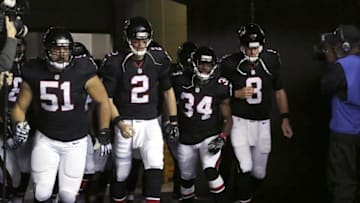 Dec 18, 2016; Atlanta, GA, USA; Atlanta Falcons center Alex Mack (51), quarterback Matt Ryan (2), cornerback Brian Poole (34), and quarterback Matt Schaub (8) run onto the field prior to their game against the San Francisco 49ers at the Georgia Dome. Mandatory Credit: Jason Getz-USA TODAY Sports