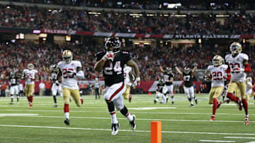 Dec 18, 2016; Atlanta, GA, USA; Atlanta Falcons running back Devonta Freeman (24) scores a rushing touchdown in the third quarter of their game against the San Francisco 49ers at the Georgia Dome. The Falcons won 41-13. Mandatory Credit: Jason Getz-USA TODAY Sports