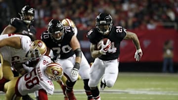 Dec 18, 2016; Atlanta, GA, USA; Atlanta Falcons running back Devonta Freeman (24) scores a long rushing touchdown in the third quarter of their game against the San Francisco 49ers at the Georgia Dome. The Falcons won 41-13. Mandatory Credit: Jason Getz-USA TODAY Sports