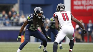 Oct 16, 2016; Seattle, WA, USA; Seattle Seahawks cornerback Richard Sherman (25) defends Atlanta Falcons wide receiver Julio Jones (11) during the second quarter at CenturyLink Field. Mandatory Credit: Joe Nicholson-USA TODAY Sports