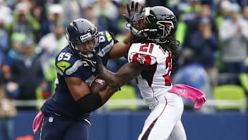 Oct 16, 2016; Seattle, WA, USA; Seattle Seahawks wide receiver Doug Baldwin (89) stiff arms away from a tackle by Atlanta Falcons cornerback Desmond Trufant (21) during the fourth quarter at CenturyLink Field. Seattle defeated Atlanta, 26-24. Mandatory Credit: Joe Nicholson-USA TODAY Sports