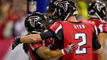 Jan 1, 2017; Atlanta, GA, USA; Atlanta Falcons running back Devonta Freeman (24) reacts with offensive guard Chris Chester (65) and quarterback Matt Ryan (2) after running for a touchdown against the New Orleans Saints during the first half at the Georgia Dome. Mandatory Credit: Dale Zanine-USA TODAY Sports