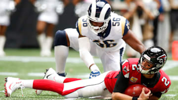 ATLANTA, GA - OCTOBER 20: Matt Ryan #2 of the Atlanta Falcons is sacked by Dante Fowler #56 of the Los Angeles Rams in the first half of an NFL game at Mercedes-Benz Stadium on October 20, 2019 in Atlanta, Georgia. (Photo by Todd Kirkland/Getty Images)