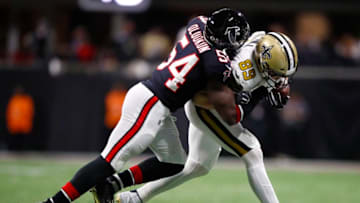 ATLANTA, GA - NOVEMBER 28: Josh Hill #89 of the New Orleans Saints is knocked out of bounds by Foye Oluokun #54 of the Atlanta Falcons during the second half of an NFL game at Mercedes-Benz Stadium on November 28, 2019 in Atlanta, Georgia. (Photo by Todd Kirkland/Getty Images)