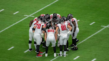 GLENDALE, ARIZONA - OCTOBER 13: Matt Ryan #2 of the Atlanta Falcons calls a play in the huddle during the NFL game against the Arizona Cardinals at State Farm Stadium on October 13, 2019 in Glendale, Arizona. The Cardinals defeated the Falcons 34-33. (Photo by Jennifer Stewart/Getty Images)