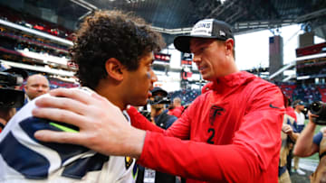 ATLANTA, GA - OCTOBER 27: Matt Ryan #2 of the Atlanta Falcons speaks with Russell Wilson #3 of the Seattle Seahawks at the conclusion of an NFL game at Mercedes-Benz Stadium on October 27, 2019 in Atlanta, Georgia. (Photo by Todd Kirkland/Getty Images)