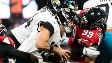ATLANTA, GA - DECEMBER 22: Gardner Minshew II #15 of the Jacksonville Jaguars is brought down by Grady Jarrett #97 and Adrian Clayborn #99 of the Atlanta Falcons during the first half of a game at Mercedes-Benz Stadium on December 22, 2019 in Atlanta, Georgia. (Photo by Carmen Mandato/Getty Images)