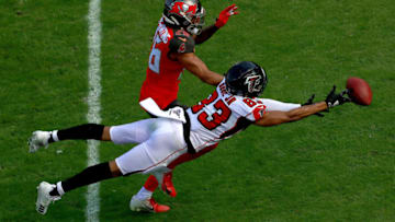 TAMPA, FLORIDA - DECEMBER 29: Russell Gage #83 of the Atlanta Falcons has a pass broken up by Sean Murphy-Bunting #26 of the Tampa Bay Buccaneers during a game at Raymond James Stadium on December 29, 2019 in Tampa, Florida. (Photo by Mike Ehrmann/Getty Images)