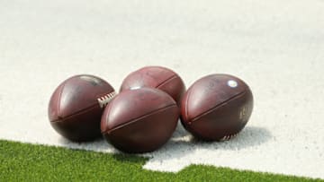 INGLEWOOD, CALIFORNIA - AUGUST 27: Footballs sit on the field ready for play during Los Angeles Chargers Training Camp at Sofi Stadium on August 27, 2020 in Inglewood, California. (Photo by Joe Scarnici/Getty Images)