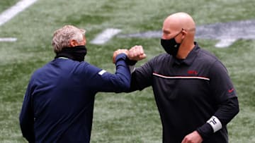 ATLANTA, GEORGIA - SEPTEMBER 13: Head coach Dan Quinn of the Atlanta Falcons and head coach Pete Carroll of the Seattle Seahawks bump forearms as they meet during pregame warmups at Mercedes-Benz Stadium on September 13, 2020 in Atlanta, Georgia. (Photo by Kevin C. Cox/Getty Images)