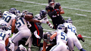ATLANTA, GEORGIA - SEPTEMBER 13: Todd Gurley II #21 of the Atlanta Falcons dives for a touchdown in the first half against the Seattle Seahawks at Mercedes-Benz Stadium on September 13, 2020 in Atlanta, Georgia. (Photo by Kevin C. Cox/Getty Images)