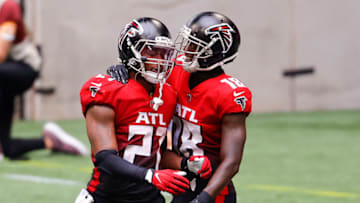ATLANTA, GEORGIA - OCTOBER 25: Todd Gurley II #21 of the Atlanta Falcons is congratulated by Calvin Ridley #18 after a 10-yard rushing touchdown against the Detroit Lions during the second half at Mercedes-Benz Stadium on October 25, 2020 in Atlanta, Georgia. (Photo by Kevin C. Cox/Getty Images)