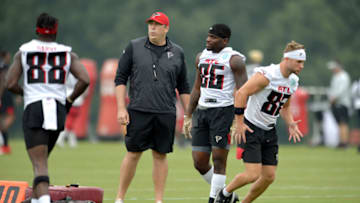 FLOWERY BRANCH, GA - JULY 30: Head coach Arthur Smith of the Atlanta Falcons watches while Austin Trammell #82, Antonio Nunn #86 and Frank Darby #88 participate in a drill during training camp at IBM Performance Field on July 30, 2021 in Flowery Branch, Georgia. (Photo by Edward M. Pio Roda/Getty Images)