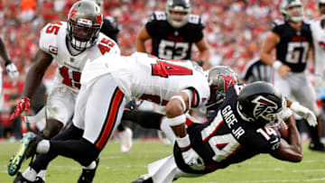 TAMPA, FLORIDA - SEPTEMBER 19: Russell Gage #14 of the Atlanta Falcons stretches out after the catch against Carlton Davis #24 of the Tampa Bay Buccaneers in the third quarter of the game at Raymond James Stadium on September 19, 2021 in Tampa, Florida. (Photo by Douglas P. DeFelice/Getty Images)