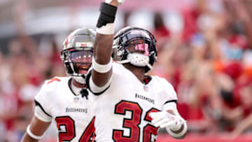 TAMPA, FLORIDA - SEPTEMBER 19: Mike Edwards #32 of the Tampa Bay Buccaneers celebrates after returning an interception for a touchdown against the Atlanta Falcons in the fourth quarter of the game at Raymond James Stadium on September 19, 2021 in Tampa, Florida. (Photo by Douglas P. DeFelice/Getty Images)