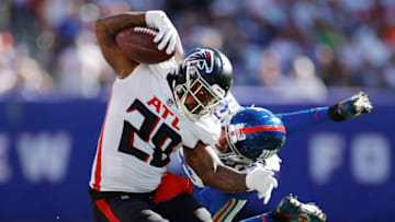 EAST RUTHERFORD, NEW JERSEY - SEPTEMBER 26: Logan Ryan #23 of the New York Giants tackles Mike Davis #28 of the Atlanta Falcons during the second half at MetLife Stadium on September 26, 2021 in East Rutherford, New Jersey. (Photo by Sarah Stier/Getty Images)