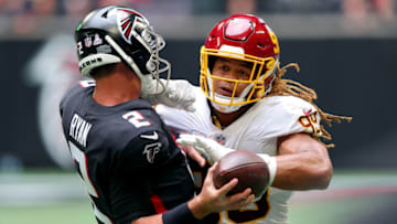 ATLANTA, GEORGIA - OCTOBER 03: Chase Young #99 of the Washington Football Team hits quarterback Matt Ryan #2 of the Atlanta Falcons in the third quarter at Mercedes-Benz Stadium on October 03, 2021 in Atlanta, Georgia. Young was called for roughing the passer on the play. (Photo by Kevin C. Cox/Getty Images)